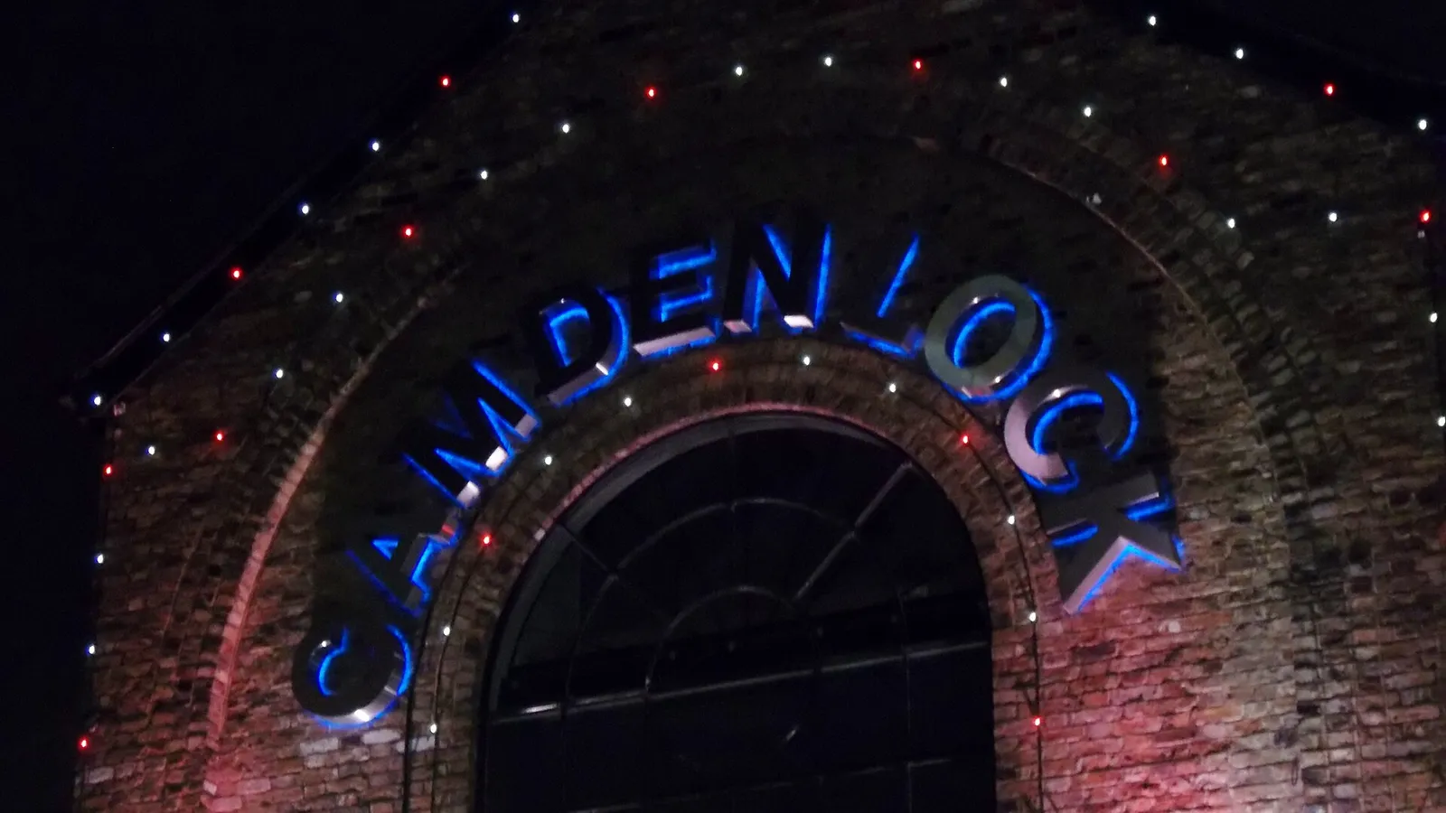 Camden Lock sign lit up at night