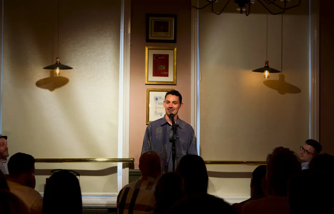 Stand-up comedian entertaining the crowd at JK Comedy Club Covent Garden