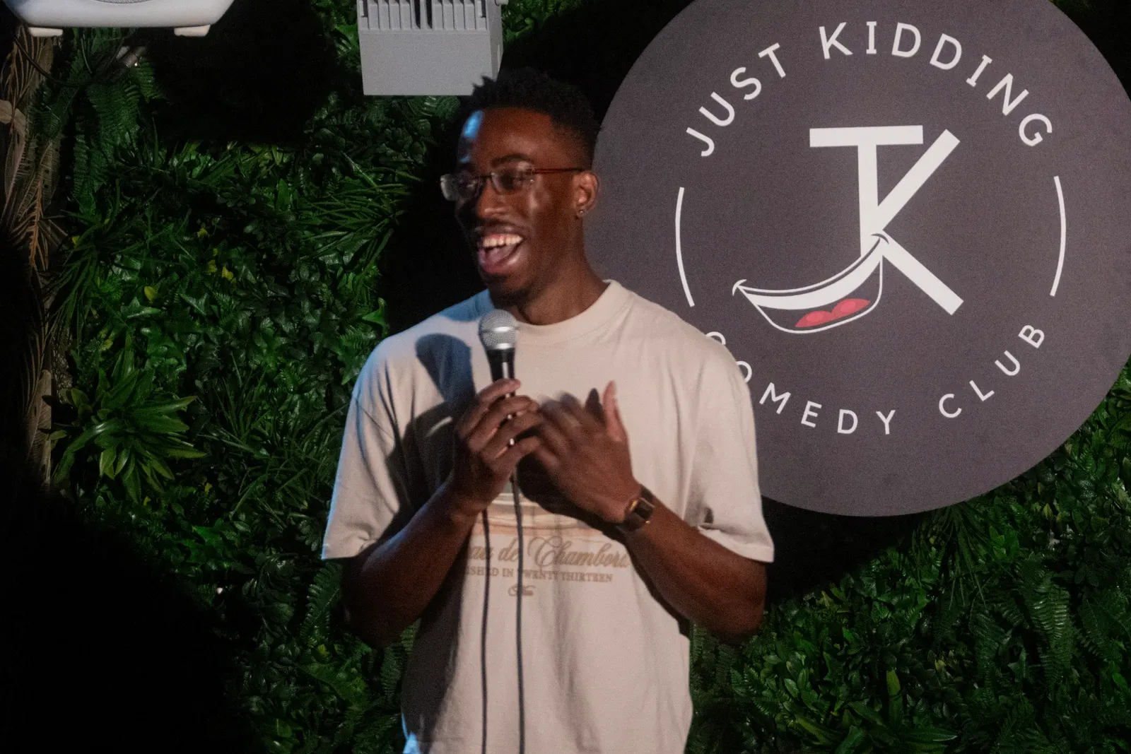Comedian performing live stand-up on stage at JK Comedy Club Covent Garden, Arboretum