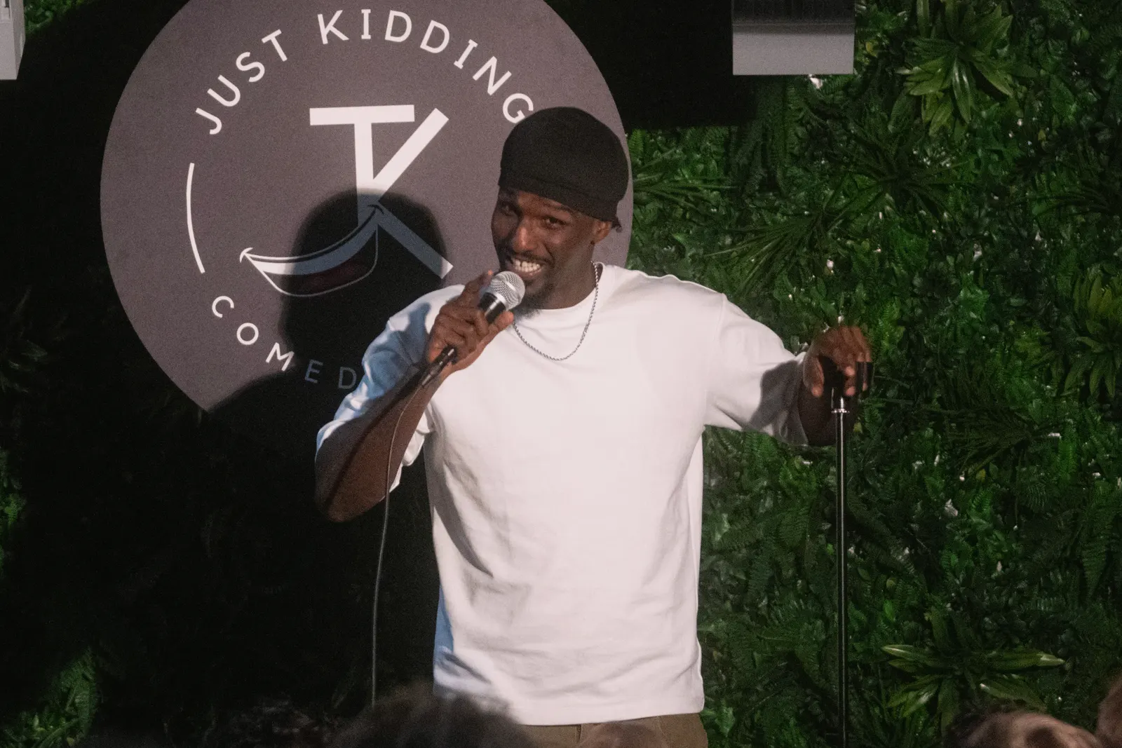 Comedian performing live stand-up on stage at JK Comedy Club Covent Garden, Arboretum