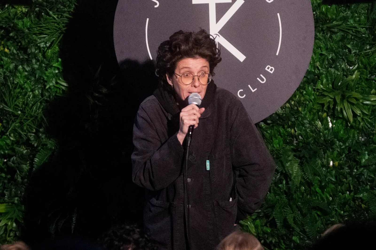 Comedian performing live stand-up on stage at JK Comedy Club Covent Garden, Arboretum