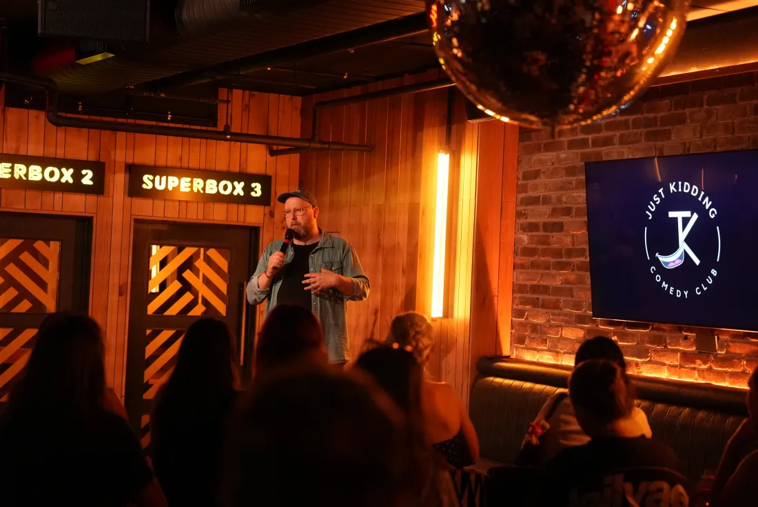 Stand-up comedian on stage at JK Comedy Club Piccadilly Circus