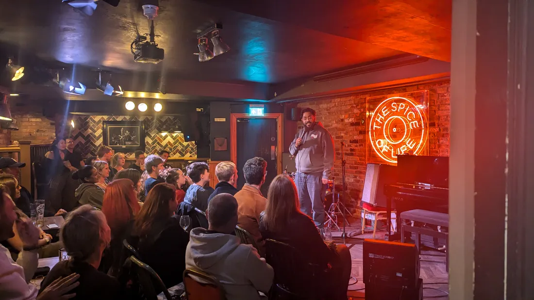 Packed Saturday afternoon audience laughing at JK Comedy Club Soho